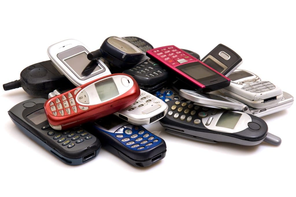 used old GSM Cell phones over white